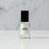 Amber Tarragon Perfume on White Marble background