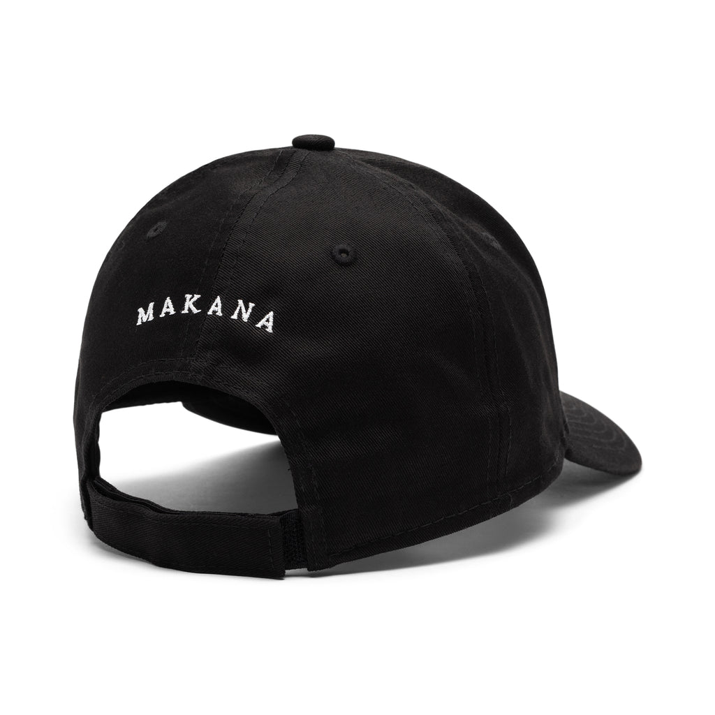 the back of a black cap with a Makana logo on a white background