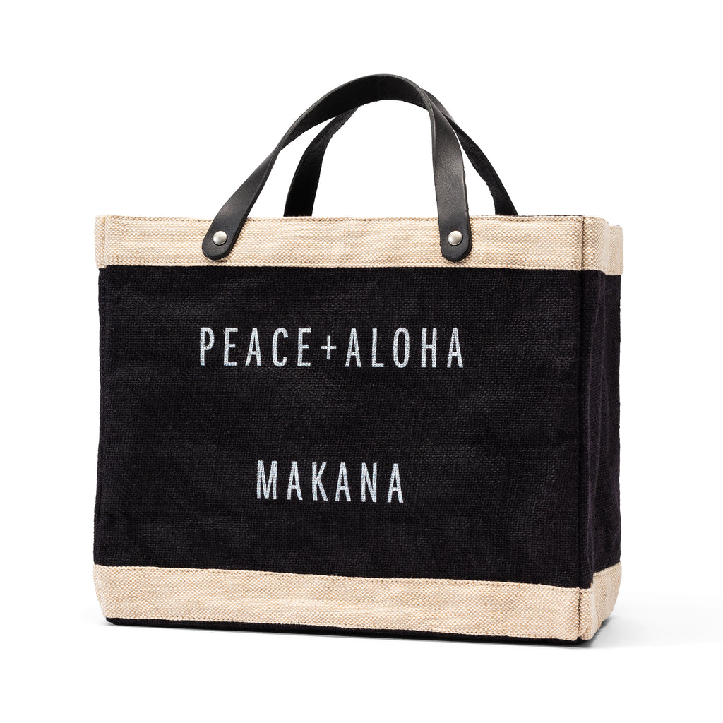 a black jute tote that says Peace + Aloha Makana on the front on a white background