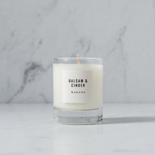 A seasonal Balsam & Cinder - Petite Candle with the word amarillo on it.